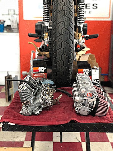 Twin carburetor banks with K&N filters on the bench