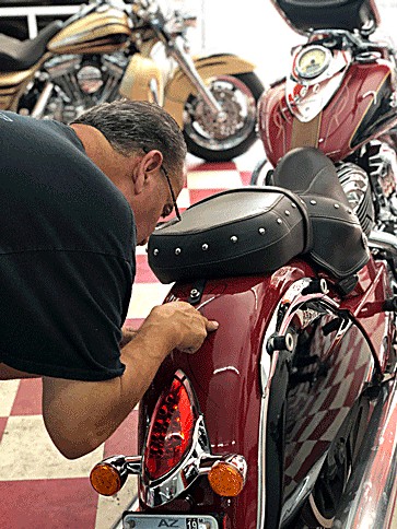 Johnny Goodson detailing a red Indian cruiser